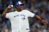 Former Toronto Blue Jays player Joe Carter arrives to send the ceremonial first pitch prior to first inning Game 2 World Series playoff MLB baseball action between the Toronto Blue Jays and the Los Angeles Dodgers, in Toronto, Saturday, Oct. 25, 2025. THE CANADIAN PRESS/Nathan Denette