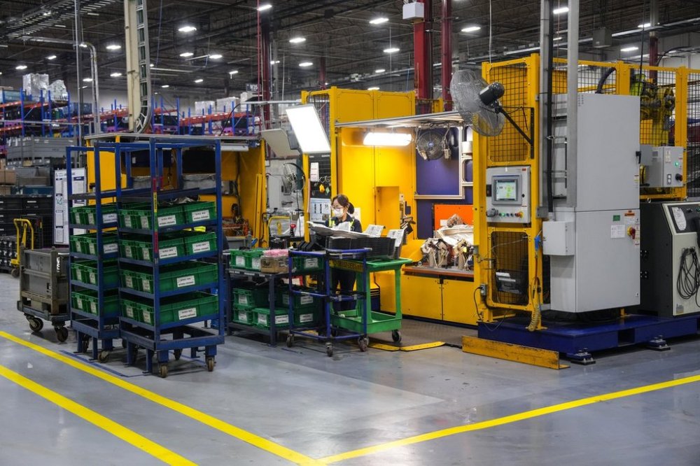 An employee works on the production line at the Martinrea auto parts manufacturing plant in Woodbridge, Ontario on Monday February 3, 2025.The site supplies auto parts to both the Canadian and US auto plants. THE CANADIAN PRESS/Chris Young