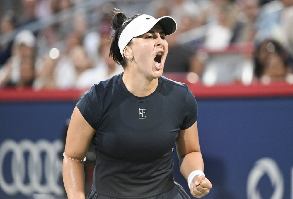 Bianca Andreescu, of Canada, reacts during her first round match against Barbora Krejcikova, of the Czech Republic, at the National Bank Open tennis tournament in Montreal, Sunday, July 27, 2025. THE CANADIAN PRESS/Graham Hughes