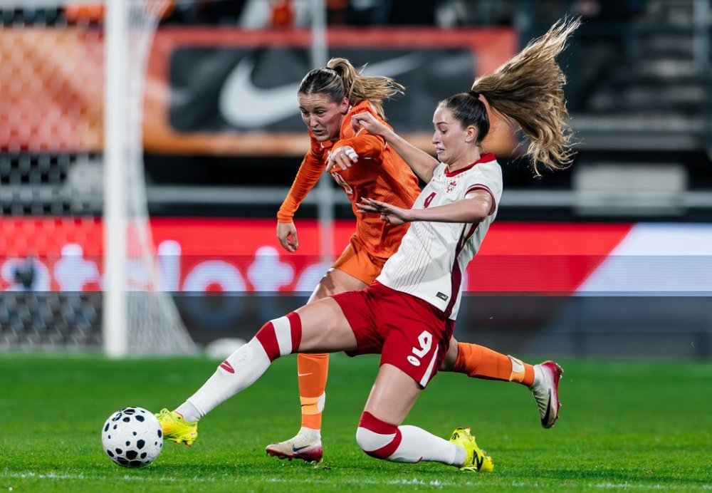 Canadian forward Jordyn Huitema, front, lunges for the ball in Canada's 1-0 loss to the Netherlands in Nijmegen, Netherlands in this Tuesday, Oct. 28, 2025 handout photo.THE CANADIAN PRESS/Handout - Canada Soccer/Audrey Magny (Mandatory Credit)