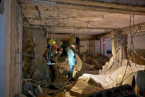 This photo released by Moscow Region Governor Andrei Vorobyev official telegram channel shows investigators working in the damaged multi-storey apartment building hit by a Ukrainian drone in Krasnogorsk, just outside Moscow, Russia, on Friday, Oct. 24, 2025. (Moscow Region Governor Andrei Vorobyev official telegram channel via AP)