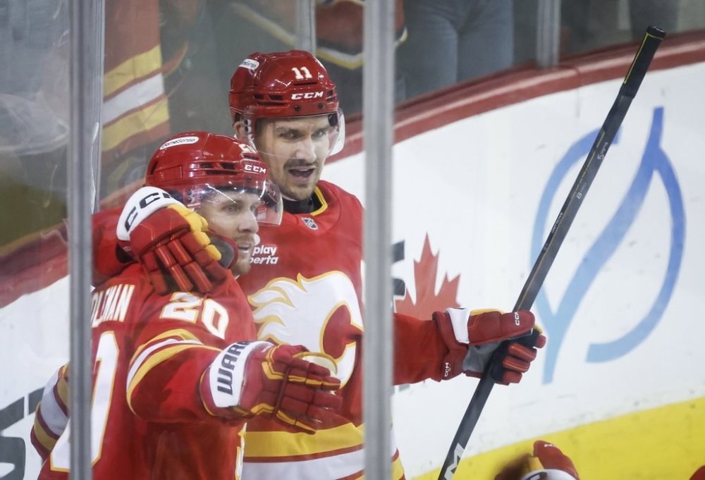 Calgary Flames' Blake Coleman, left, celebrates his goal with teammate Mikael Backlund during third period NHL hockey action against the New York Rangers in Calgary, Alta., Sunday, Oct. 26, 2025. THE CANADIAN PRESS/Jeff McIntosh
