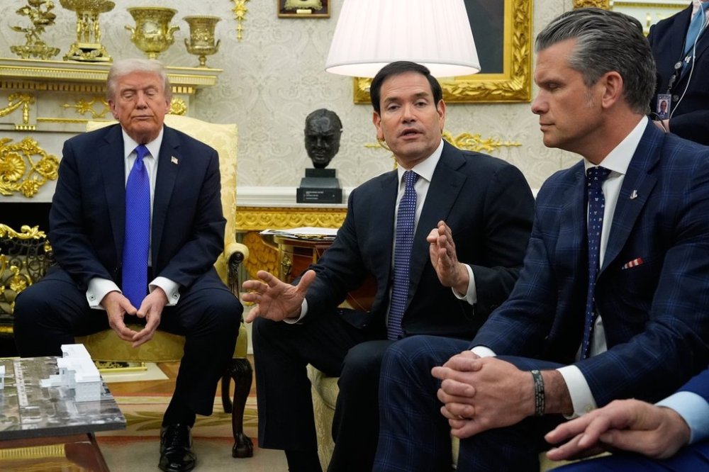 President Donald Trump and Defense Secretary Pete Hegseth listen as Secretary of State Marco Rubio speaks during a meeting with NATO Secretary General Mark Rutte in the Oval Office of the White House, Wednesday, Oct. 22, 2025, in Washington. (AP Photo/Alex Brandon)