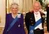 FILE - Britain's Queen Camilla, left, and King Charles III, right, pose for a photo before a State Banquet at Windsor Castle, in Windsor, England, Sept. 17, 2025. (Phil Noble/Pool Photo via AP, file)