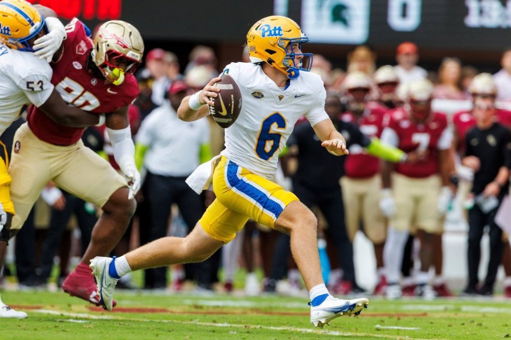 Pittsburgh quarterback Mason Heintschel (6) runs during the first half of an NCAA college football game against Florida State, Saturday, Oct. 11, 2025, in Tallahassee, Fla. (AP Photo/Colin Hackley)