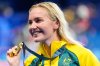 FILE - Australia's Ariarne Titmus poses with her gold medal after winning the women's 400-meter freestyle final at the 2024 Summer Olympics, Saturday, July 27, 2024, in Nanterre, France. (AP Photo/Ashley Landis,File)