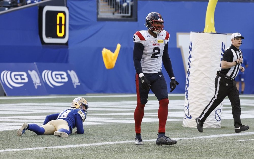 Montreal Alouettes' Shawn Oakman (2) gets called for roughing the passer as Winnipeg Blue Bombers' kicker Jamieson Sheahan (18) lies in his end zone during second half CFL action in Winnipeg Saturday, October 25, 2025. THE CANADIAN PRESS/John Woods