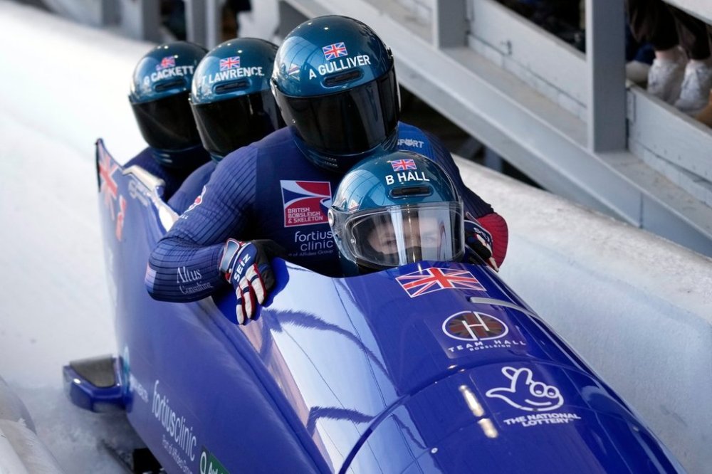 FILE - Great Britain's Brad Hall, Arran Gulliver, Taylor Lawrence and Greg Cackett finish their run in the fourth heat to win third place in the 4-man bobsled race during the bobsled world championships, March 15, 2025, in Lake Placid, N.Y. (AP Photo/Seth Wenig, File)