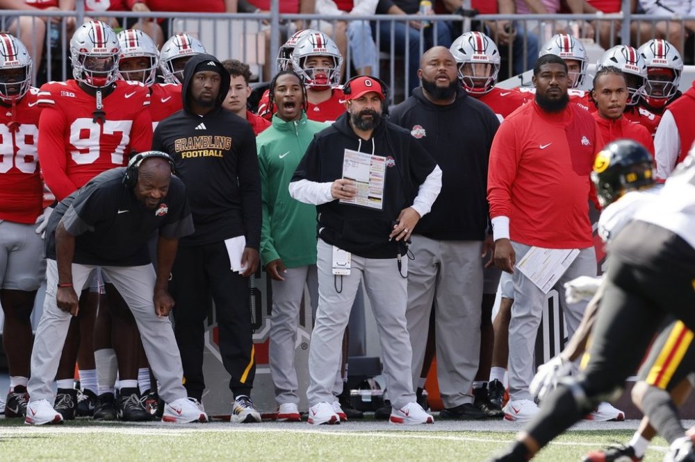 FILE - Ohio State defensive coordinator Matt Patricia, red hat, watches his defense play against Grambling State during an NCAA college football game, Saturday, Sept. 6, 2025, in Columbus, Ohio. (AP Photo/Jay LaPrete, File)