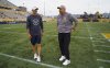 Montreal Alouettes Head Coach Jason Maas, left, chats with Hamilton Tiger Cats Head Coach and Offensive Coordinator Scott Milanovich before the start of CFL football game action in Hamilton, Ont. on Friday, June 27, 2025. THE CANADIAN PRESS/Peter Power