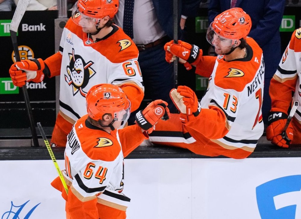 Anaheim Ducks center Mikael Granlund (64) is congratulated after his goal against the Boston Bruins during the third period of an NHL hockey game, Thursday, Oct. 23, 2025, in Boston. (AP Photo/Charles Krupa)