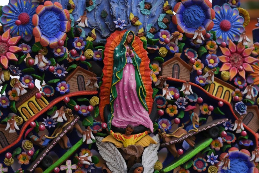 A statue of the Virgin of Guadalupe decorates a tree of life sculpture in the main square of Metepec, Mexico, Thursday, Oct. 9, 2025. (AP Photo/Fernando Llano)