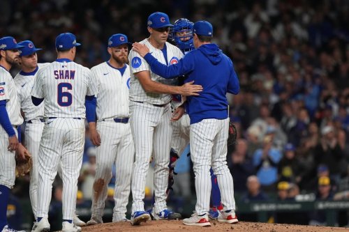 Chicago Cubs manager Craig Counsell acknowledges starting pitcher Matthew Boyd (16) while making a pitching change during the fifth inning of Game 4 of baseball's National League Division Series against the Milwaukee Brewers Thursday, Oct. 9, 2025, in Chicago. (AP Photo/Nam Y. Huh)