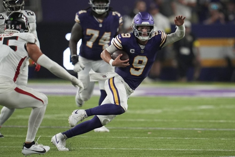 Minnesota Vikings quarterback J.J. McCarthy (9) runs the ball during the second half of an NFL football game against the Atlanta Falcons, Sunday, Sept. 14, 2025, in Minneapolis. (AP Photo/Mike Stewart)