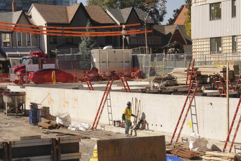 Construction is seen on a 78-unit, four-storey building with affordable homes, in Toronto's Kensington Market, on Thursday, Oct. 9, 2025. The project is part of the city's rapid housing initiative, which aims to create stable, supportive homes for those in need. THE CANADIAN PRESS/Chris Young