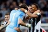 Newcastle United goalkeeper Nick Pope, second left, celebrates with teammates after assisting Harvey Barnes to score during the UEFA Champions League match between Benfica and Newcastle, in Newcastle-upon-Tyne, England, Tuesday Oct. 21, 2025. (Richard Sellers/PA via AP)