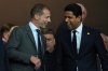 UEFA President Aleksander Ceferin, left, and PSG president Nasser Al-Khelaifi laugh before the Champions League opening phase soccer match between Barcelona and Paris Saint-Germain at the Lluis Companys Olympic Stadium in Barcelona, Spain, Wednesday, Oct.1, 2025. (AP Photo/Emilio Morenatti)