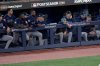 The Seattle Mariners watch from their dugout during the ninth inning in Game 7 of baseball's American League Championship Series against the Toronto Blue Jays, Monday, Oct. 20, 2025, in Toronto. (AP Photo/David J. Phillip)