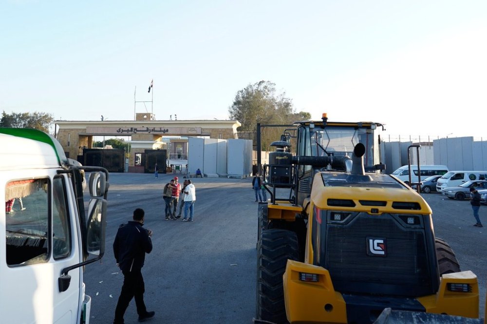 Bulldozers enter the Egyptian gate of the Rafah crossing, heading for inspection by Israeli authorities before entering the Gaza Strip, following an agreement between Israel and Hamas on a ceasefire, Sunday, Oct. 26, 2025. (AP Photo/Mohamed Arafat)