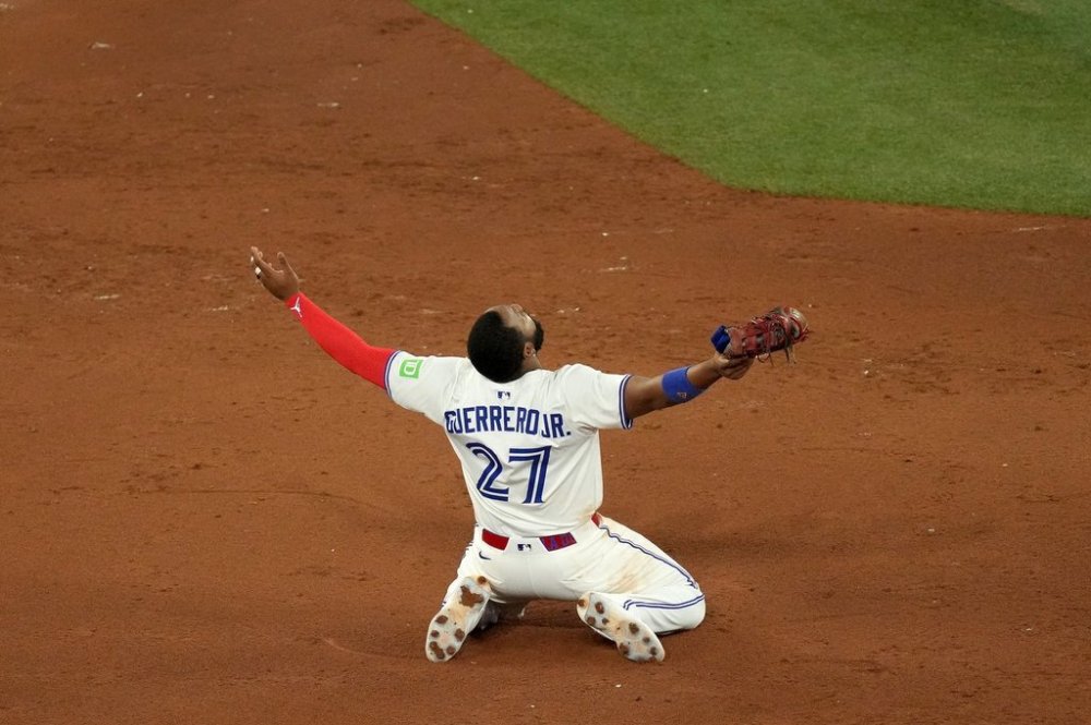 Toronto Blue Jays first base Vladimir Guerrero Jr. (27) celebrates the team's 4-3 win over the Seattle Mariners to win the MLB American League Championship Series in Toronto, Monday, Oct. 20, 2025. THE CANADIAN PRESS/Chris Young