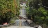 Washed out section of Donnelly Street in Mount Dora — Flooding damage in Lake County after torrential rains last night, on Monday, Oct. 27, 2025. (Ricardo Ramirez Buxeda/Orlando Sentinel via AP)