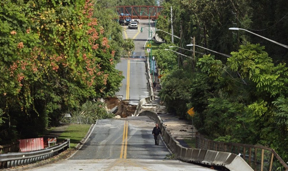 Washed out section of Donnelly Street in Mount Dora — Flooding damage in Lake County after torrential rains last night, on Monday, Oct. 27, 2025. (Ricardo Ramirez Buxeda/Orlando Sentinel via AP)