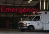 An ambulance drives past the emergency entrance of Vancouver General Hospital in Vancouver, B.C., Friday, April 9, 2021. THE CANADIAN PRESS/Jonathan Hayward