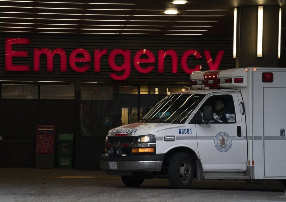 An ambulance drives past the emergency entrance of Vancouver General Hospital in Vancouver, B.C., Friday, April 9, 2021. THE CANADIAN PRESS/Jonathan Hayward