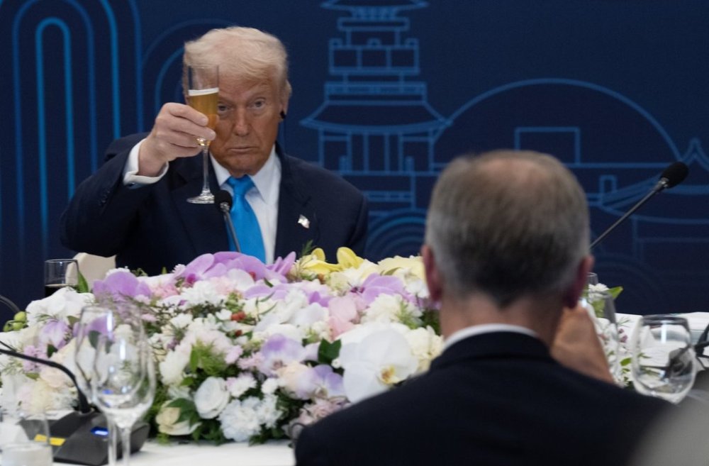 United States President Donald Trump looks to Prime Minister Mark Carney as they raise there glasses during a toast at a dinner with leaders in Gyeongju, South Korea, Wednesday, Oct 29, 2025. THE CANADIAN PRESS/Adrian Wyld