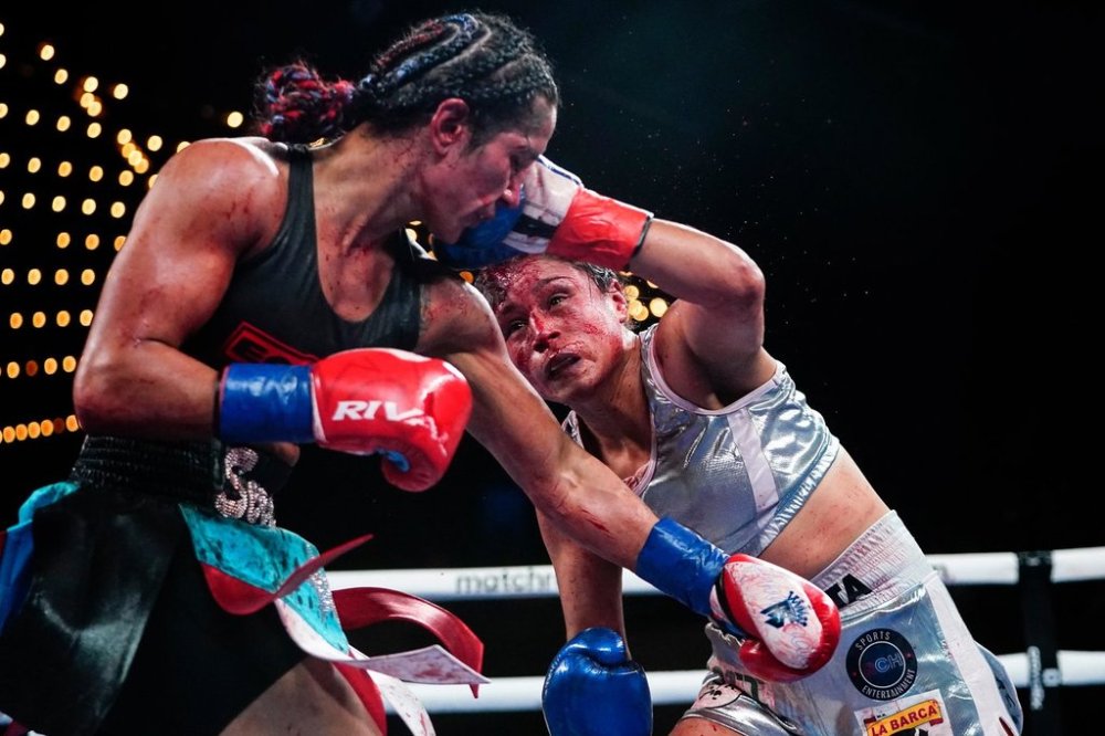 FILE - Mexico's Erika Cruz Hernandez, left, punches Puerto Rico's Amanda Serrano during the ninth round of a women's featherweight championship boxing bout Saturday, Feb. 4, 2023 in New York. (AP Photo/Frank Franklin II,File)