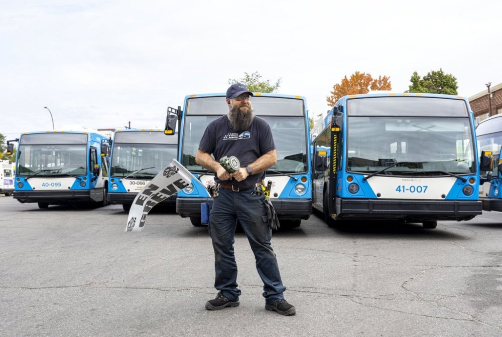 An Societe de transport de Montreal (STM) mechanic protests outside their facility in Montreal on Monday, Sept. 22, 2025. A transit strike by the maintenance workers is expected to limit service to morning and evening rush hours on Mondays, Wednesdays and Fridays. THE CANADIAN PRESS/Christinne Muschi