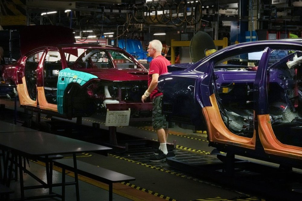 Cars pass along the assembly line at the Stellantis plant in Brampton, Ont., on Friday July 21, 2023. THE CANADIAN PRESS/Chris Young