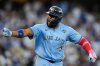 Toronto Blue Jays' Vladimir Guerrero Jr. points to his dugout after hitting a two run against the Los Angeles Dodgers during the third inning in Game 4 of baseball's World Series, Tuesday, Oct. 28, 2025, in Los Angeles. (AP Photo/Ashley Landis)