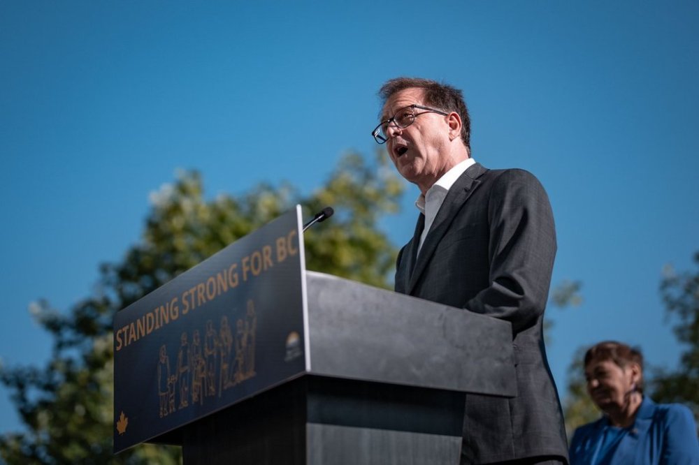 Minister of Energy and Climate Solutions, Adrian Dix speaks during a press conference in Vancouver, B.C., Monday, July 28, 2025. THE CANADIAN PRESS/Ethan Cairns