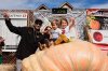 From left, Brandon Dawson celebrates with his children Roman and Ayla after winning the Safeway 52nd annual World Championship Pumpkin Weigh-Off in Half Moon Bay, Calif., Monday, Oct. 13, 2025. (AP Photo/Godofredo A. Vásquez)