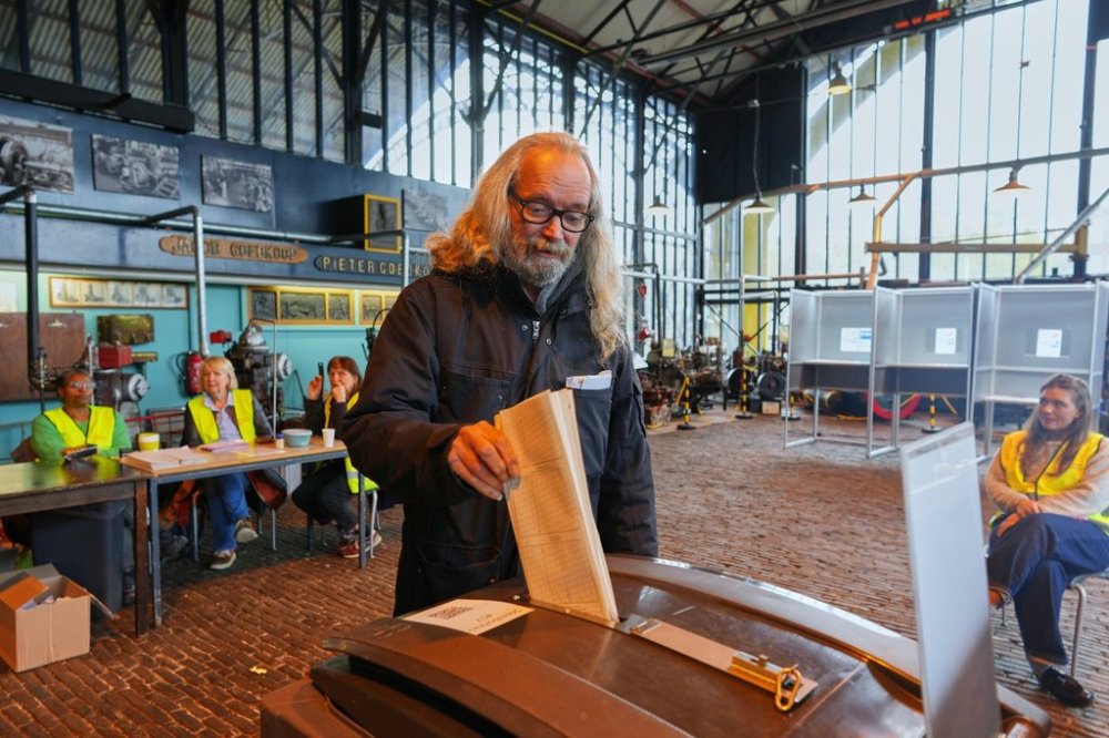 A man casts his ballot at the Kromhout shipyard museum, which is operating as a polling station, during general elections in Amsterdam, Netherlands, Wednesday, Oct. 29, 2025. (AP Photo/Peter Dejong)