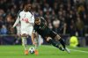 Tottenham's Destiny Udogie, left, duels for the ball with Copenhagen's Mohamed Elyounoussi during the Champions League opening phase soccer match between Tottenham and Copenhagen, in London, England, Tuesday, Nov. 4, 2025. (AP Photo/Ian Walton)