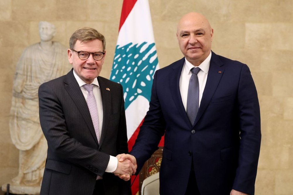 In this photo released by the Lebanese Presidency press office, Lebanese president Joseph Aoun, right, shakes hands with German Foreign Minister Johann Wadephul, in Beirut, Friday, Oct. 31, 2025. (Lebanese Presidency press office via AP)