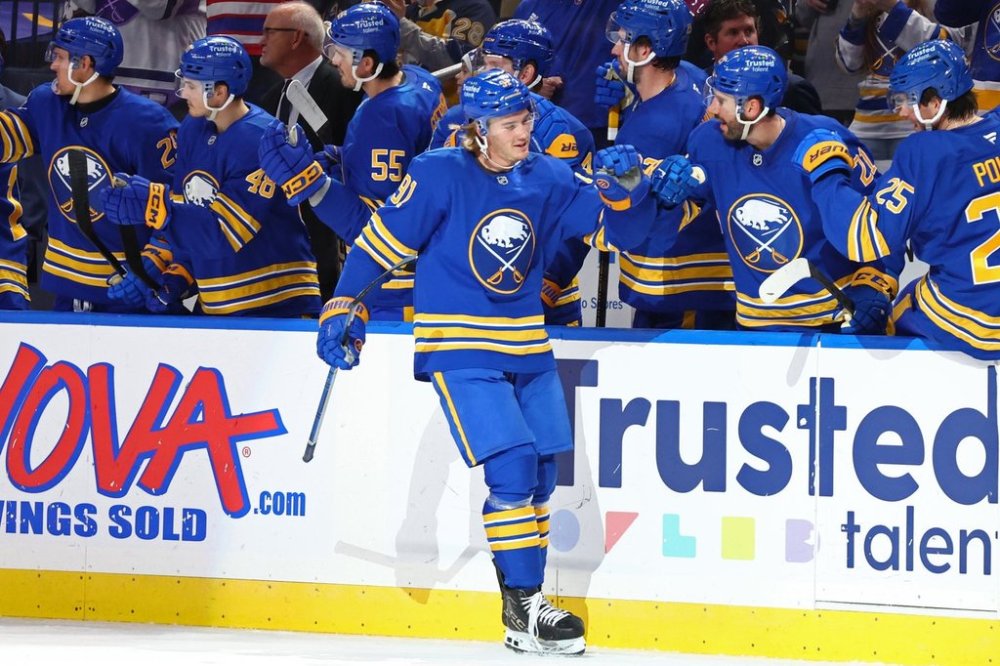 Buffalo Sabres right wing Josh Doan (91) celebrates his goal with teammates during the second period of an NHL hockey game against the Florida Panthers, Saturday, Oct. 18, 2025, in Buffalo, N.Y. (AP Photo/Jeffrey T. Barnes)