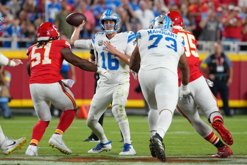 Detroit Lions quarterback Jared Goff (16) throws under pressure from Kansas City Chiefs defensive end Mike Danna (51) during the first half of an NFL football game Sunday, Oct. 12, 2025, in Kansas City, Mo. (AP Photo/Ed Zurga)