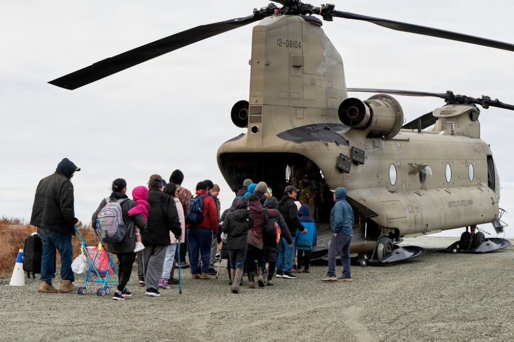 In this photo provided by the Alaska Army National Guard, displaced people are evacuated from Kwigillingok, Alaska, on Thursday, Oct. 16, 2025, following Typhoon Halong that struck Alaska's west coast. (Joseph Moon/Alaska National Guard via AP)