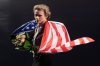 FILE - Gold medalist Ilia Malinin, of the United States, celebrates during a medal ceremony for men's free skating at the figure skating world championships, March 29, 2025, in Boston. (AP Photo/Charles Krupa, File)