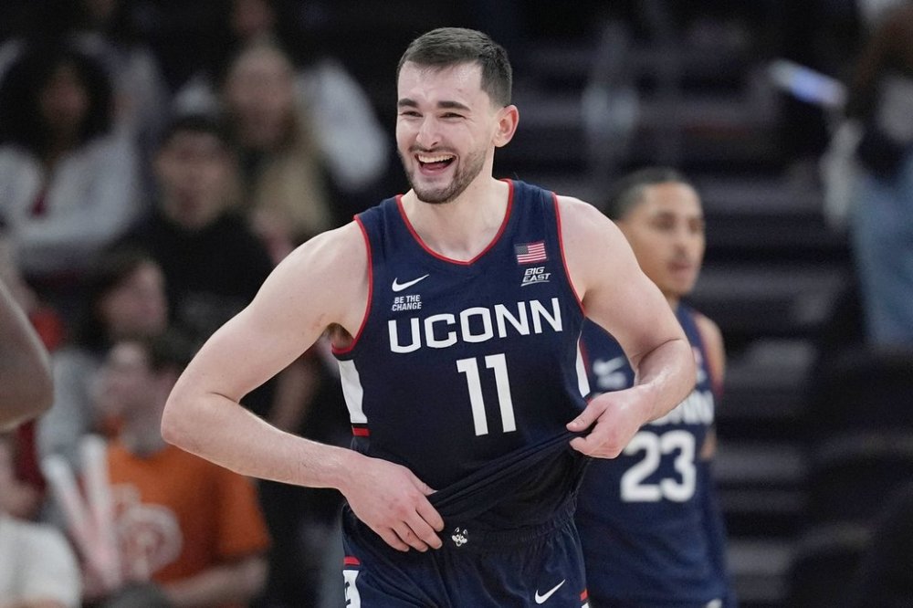 FILE - UConn forward Alex Karaban (11) celebrates the team's win over Texas following an NCAA college basketball game in Austin, Texas, Sunday, Dec. 8, 2024. (AP Photo/Eric Gay, File)