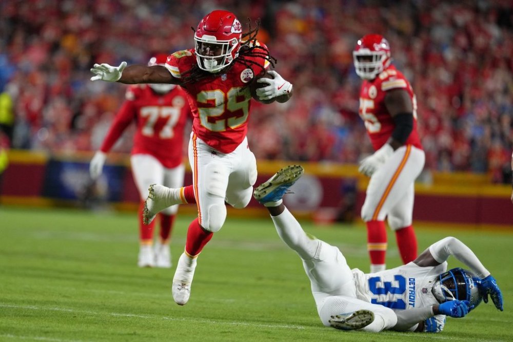 Kansas City Chiefs running back Kareem Hunt (29) runs past Detroit Lions safety Kerby Joseph (31) during the second half of an NFL football game Sunday, Oct. 12, 2025, in Kansas City, Mo. (AP Photo/Ed Zurga)