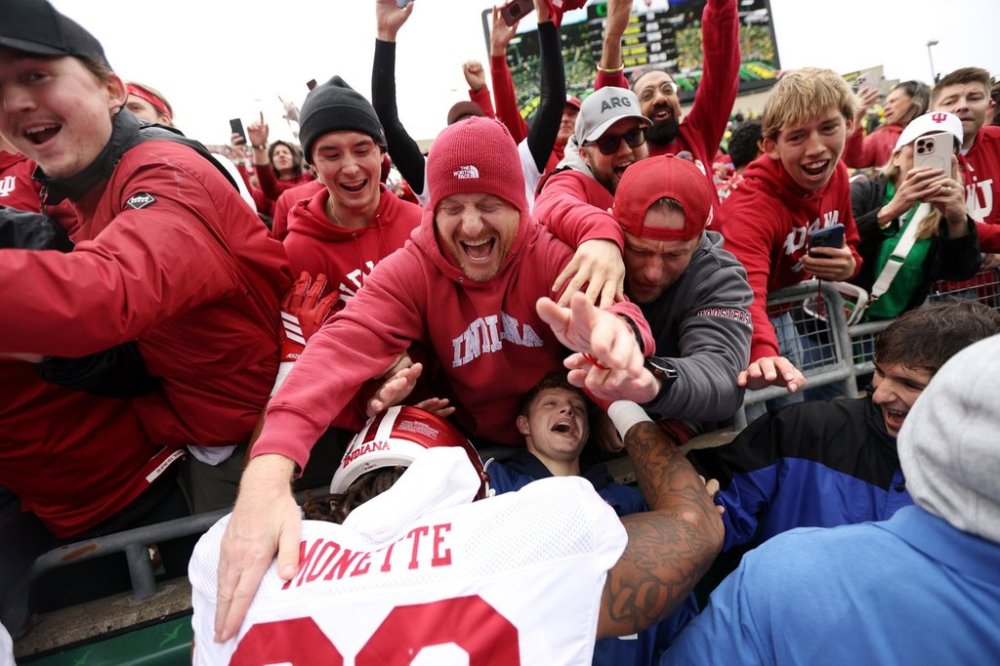 Indiana defensive lineman J'Mari Monnette, bottom,) celebrates after an NCAA college football game against Oregon, Saturday, Oct. 11, 2025, in Eugene, Ore. (AP Photo/Lydia Ely)
