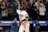 Seattle Mariners' Randy Arozarena celebrates his solo home run against the Toronto Blue Jays during the eighth inning in Game 3 of baseball's American League Championship Series, Wednesday, Oct. 15, 2025, in Seattle. (AP Photo/Lindsey Wasson)