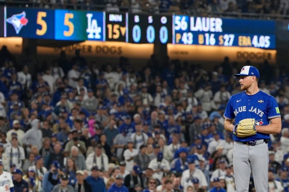 Toronto Blue Jays pitcher Eric Lauer prepares to throw during the 15th inning in Game 3 of baseball's World Series against the Dodgers on Oct. 27, 2025, in Los Angeles. (AP Photo/Ashley Landis)