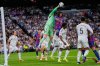 Real Madrid's goalkeeper Thibaut Courtois, top left, clears the ball next to Barcelona's Jules Kounde during the Spanish La Liga soccer match between Real Madrid and Barcelona, in Madrid, Sunday, Oct. 26, 2025. (AP Photo/Manu Fernandez)