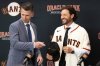 San Francisco Giants President of Baseball Operations Buster Posey, left, welcomes Tony Vitello as the new manager of the San Francisco Giants baseball team on Thursday, Oct. 30, 2025, in San Francisco. (AP Photo/Benjamin Fanjoy)