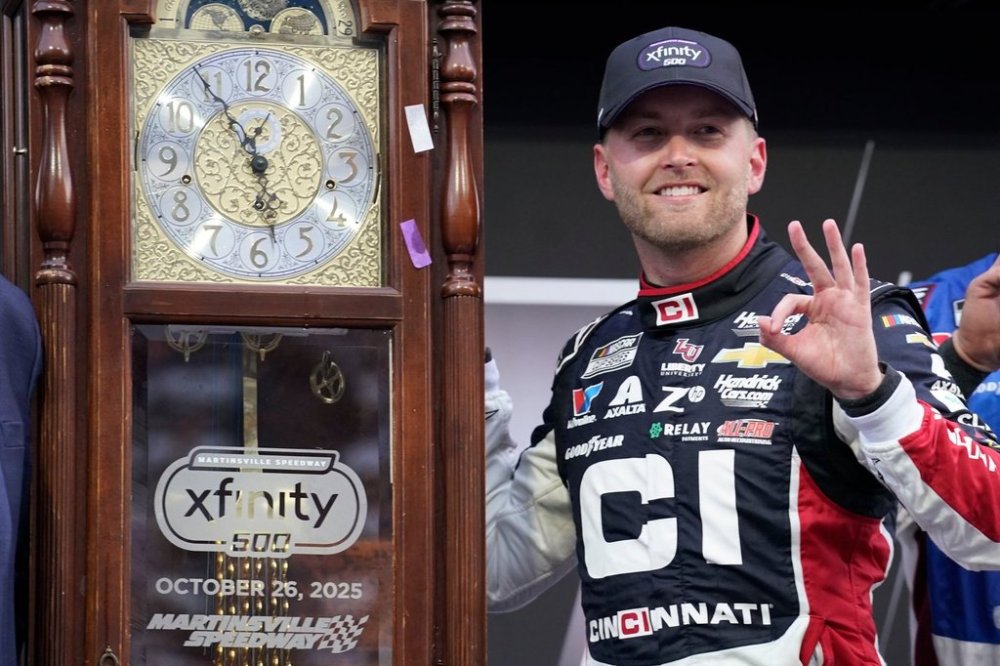 William Byron poses with the trophy in Victory Lane after winning a NASCAR Cup series auto race in Martinsville, Va., Sunday, Oct. 26, 2025. (AP Photo/Chuck Burton)